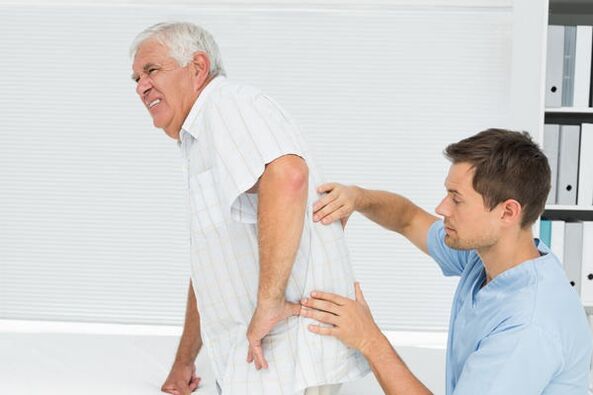 Elderly patient with low back pain, doctor saw