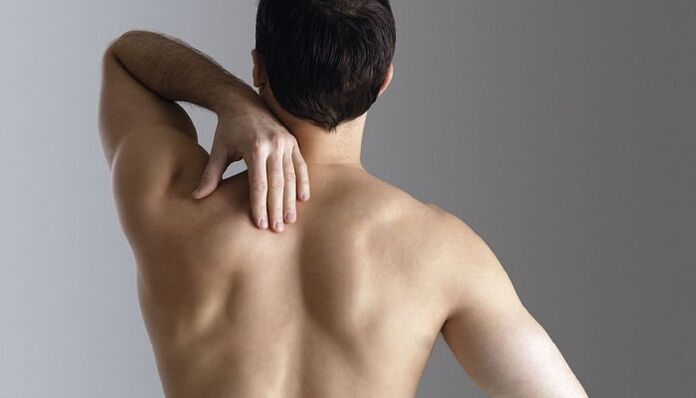 Male back pain between the shoulder blades